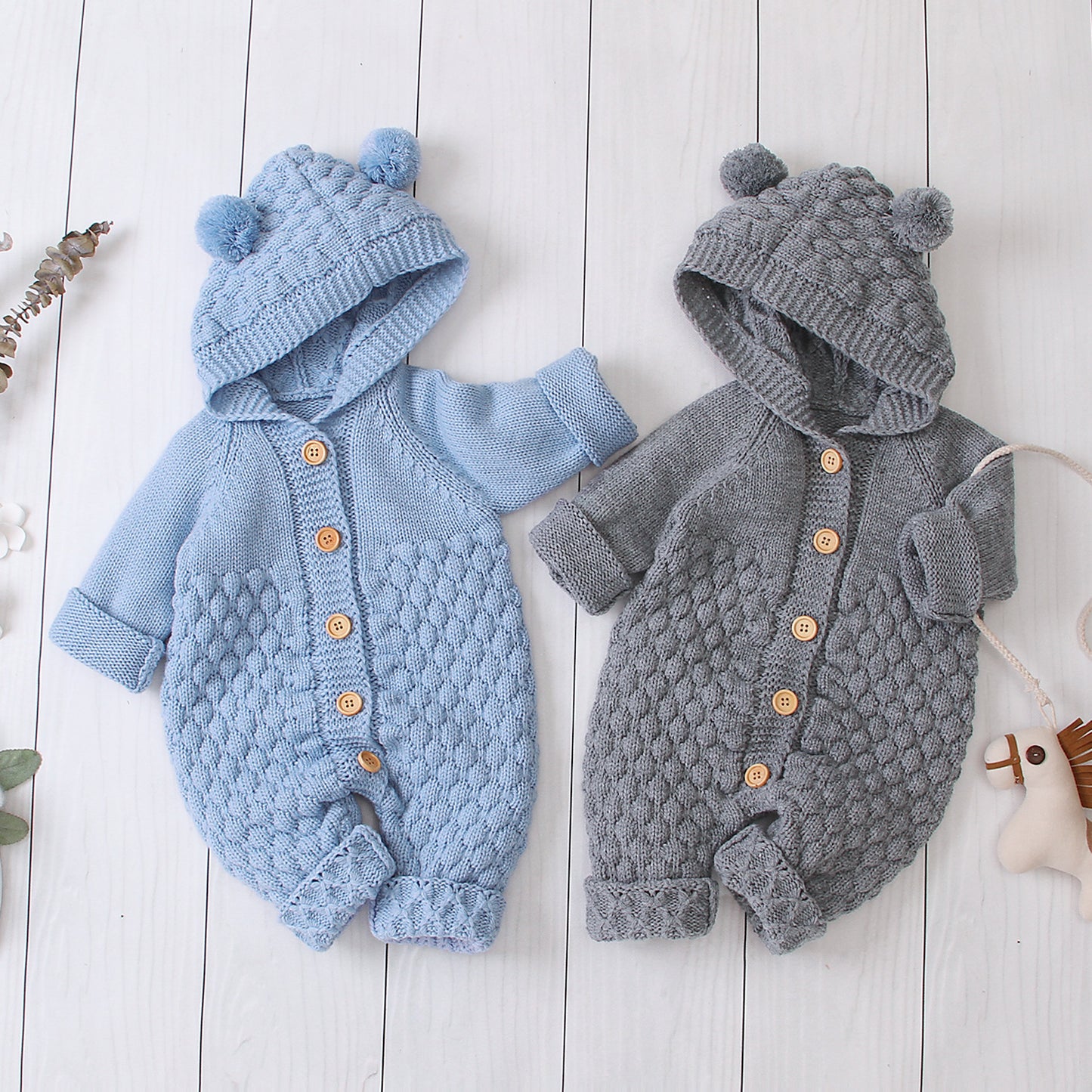 Côte & Crown knitted baby clothes with hood and pom pom ears in blue and gray with wooden buttons