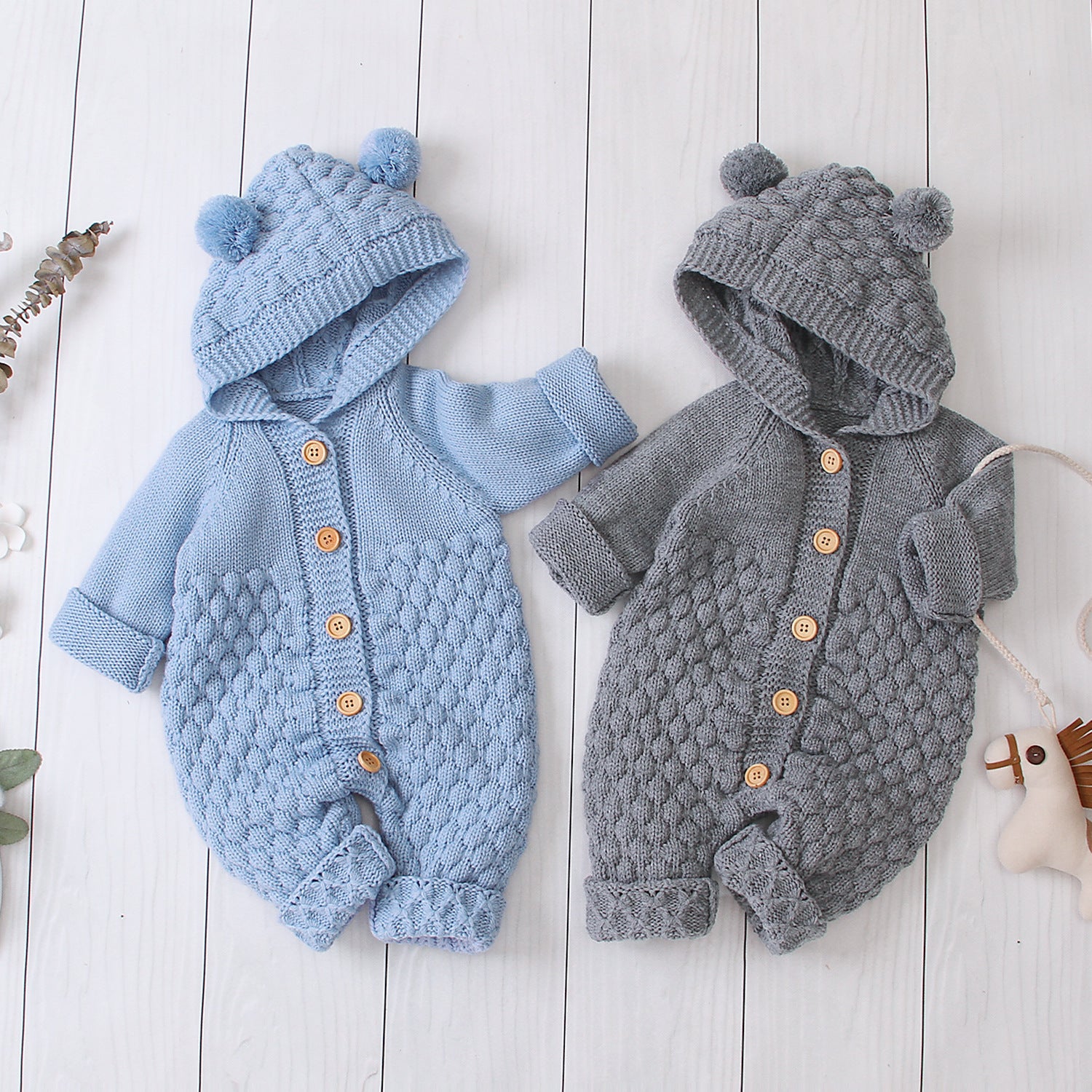 Côte & Crown knitted baby clothes with hood and pom pom ears in blue and gray with wooden buttons