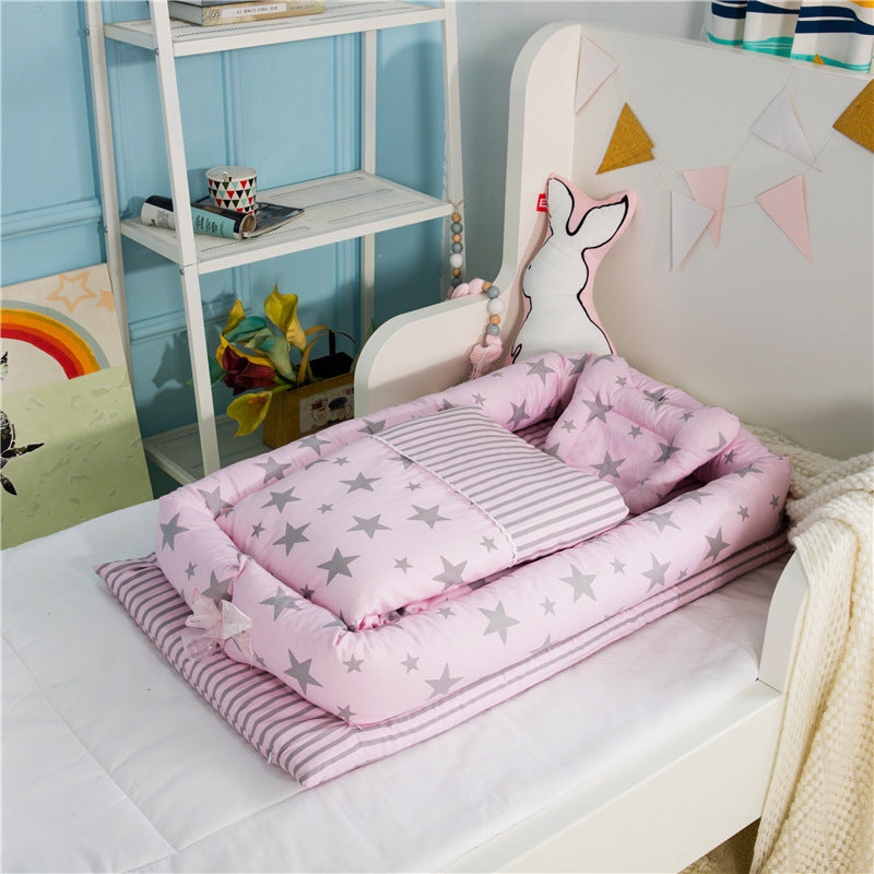 Côte & Crown newborn foldable middle bed for baby infant in pink with star and stripe patterns