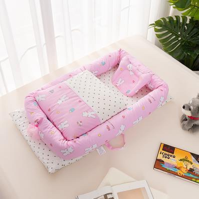 Côte & Crown pink foldable middle bed for newborns with bunny print and soft pillow support