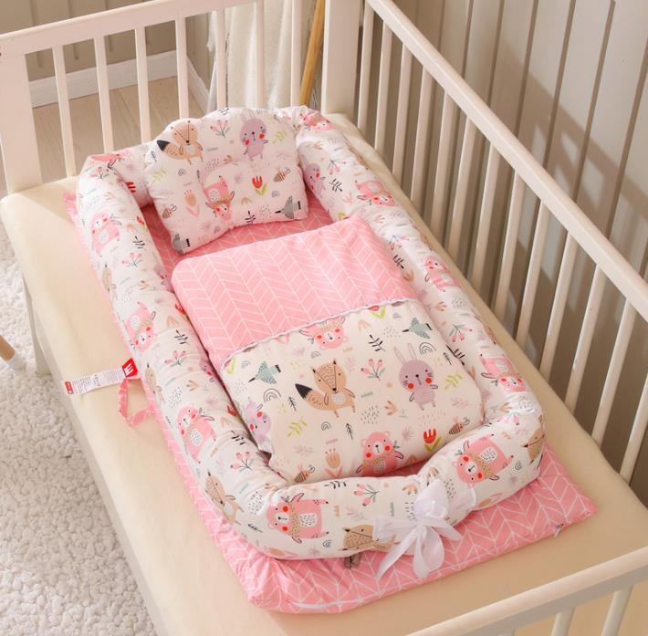 Côte & Crown foldable newborn middle bed with pink animal print design for baby infants