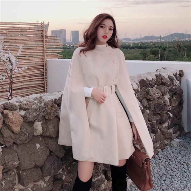 Côte & Crown womens beige belted cape coat with side buttons styled in outdoor setting