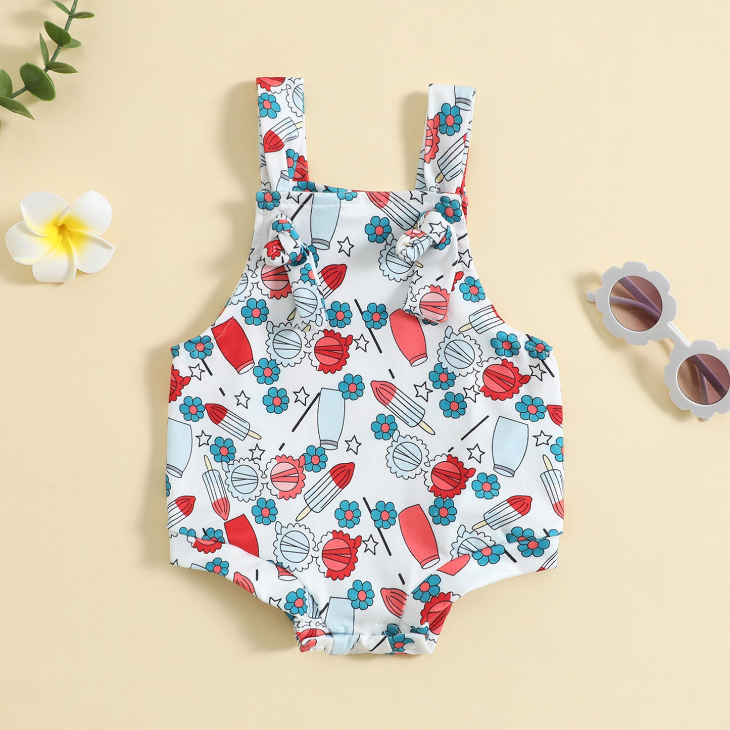 Côte & Crown baby clothes floral and rocket print sleeveless romper on beige background