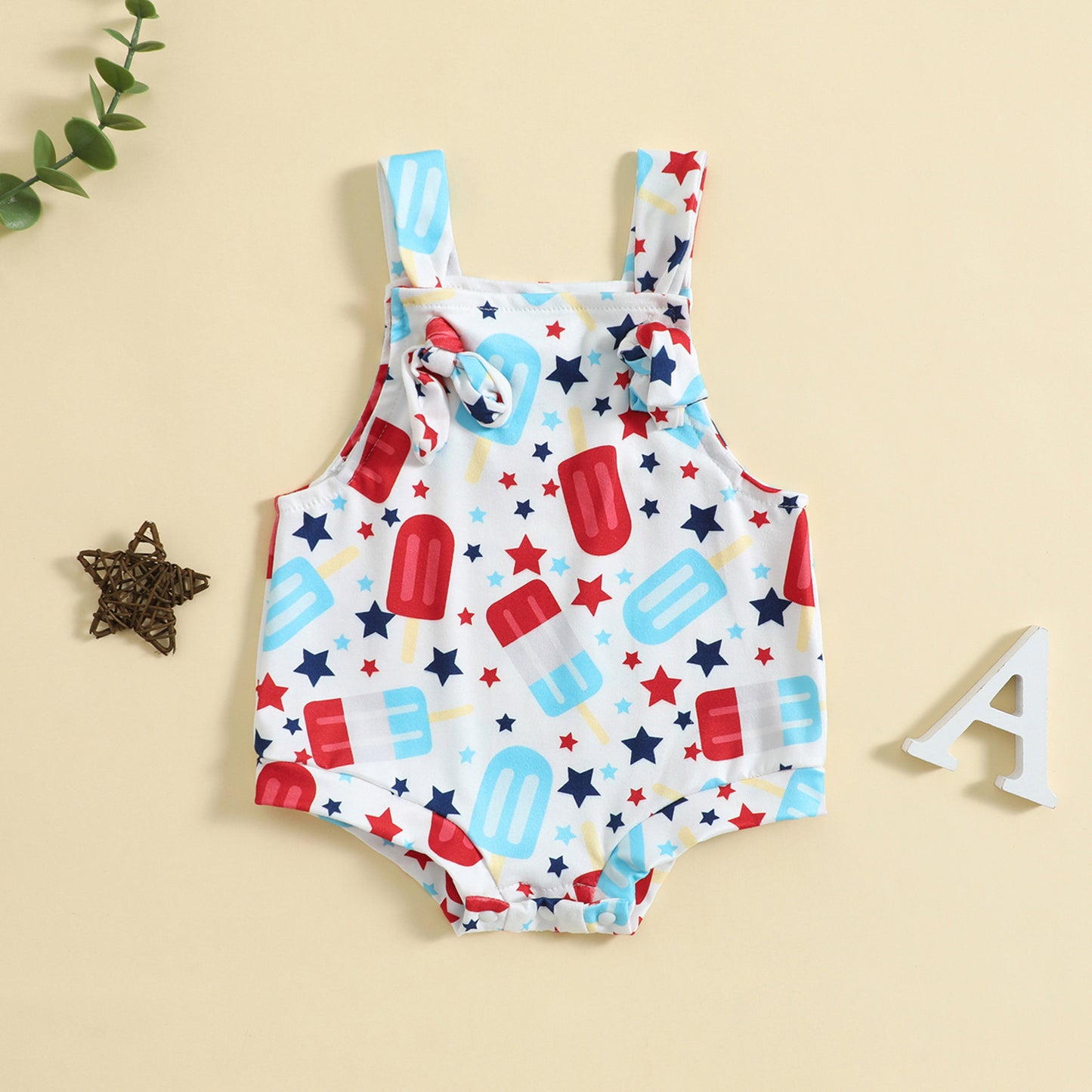 Côte & Crown baby clothes romper with red and blue popsicle and star print on white fabric