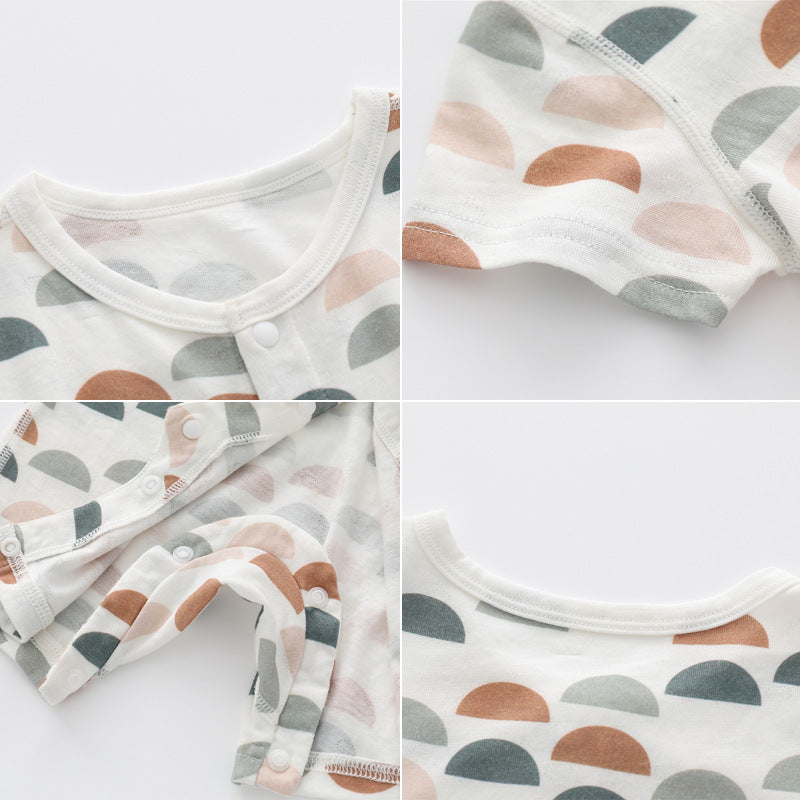 Light and soft bamboo fibre jumpsuit by Côte & Crown featuring breathable bamboo baby clothes fabric with pastel semicircle patterns