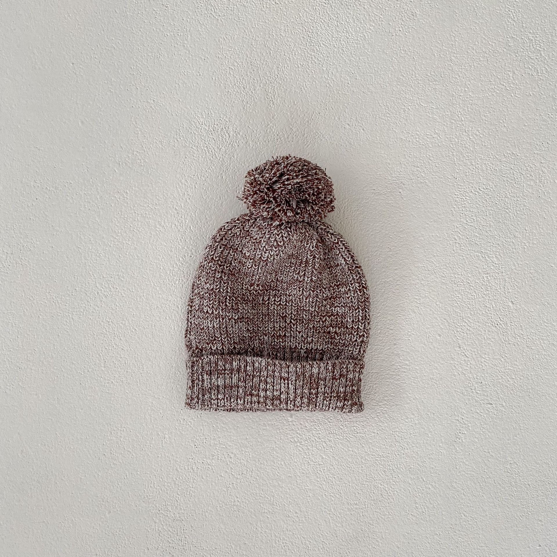 Côte & Crown soft knitted baby hat with pom pom in brown and white yarn