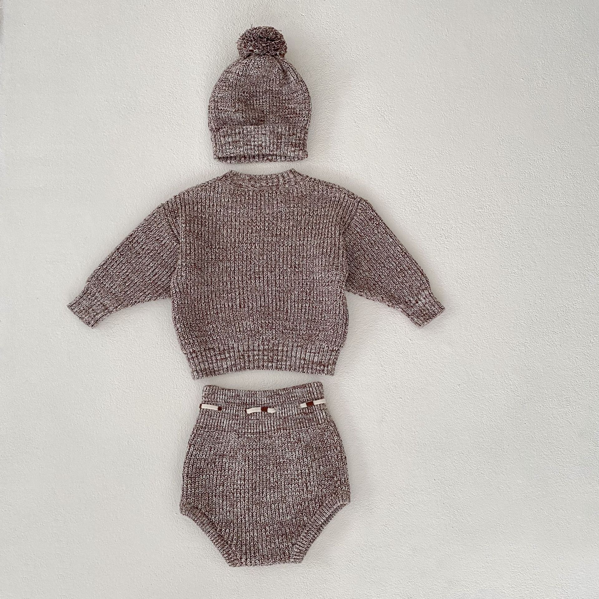 Côte & Crown three-piece knitted baby clothes set with sweater hat and diaper cover in soft brown yarn