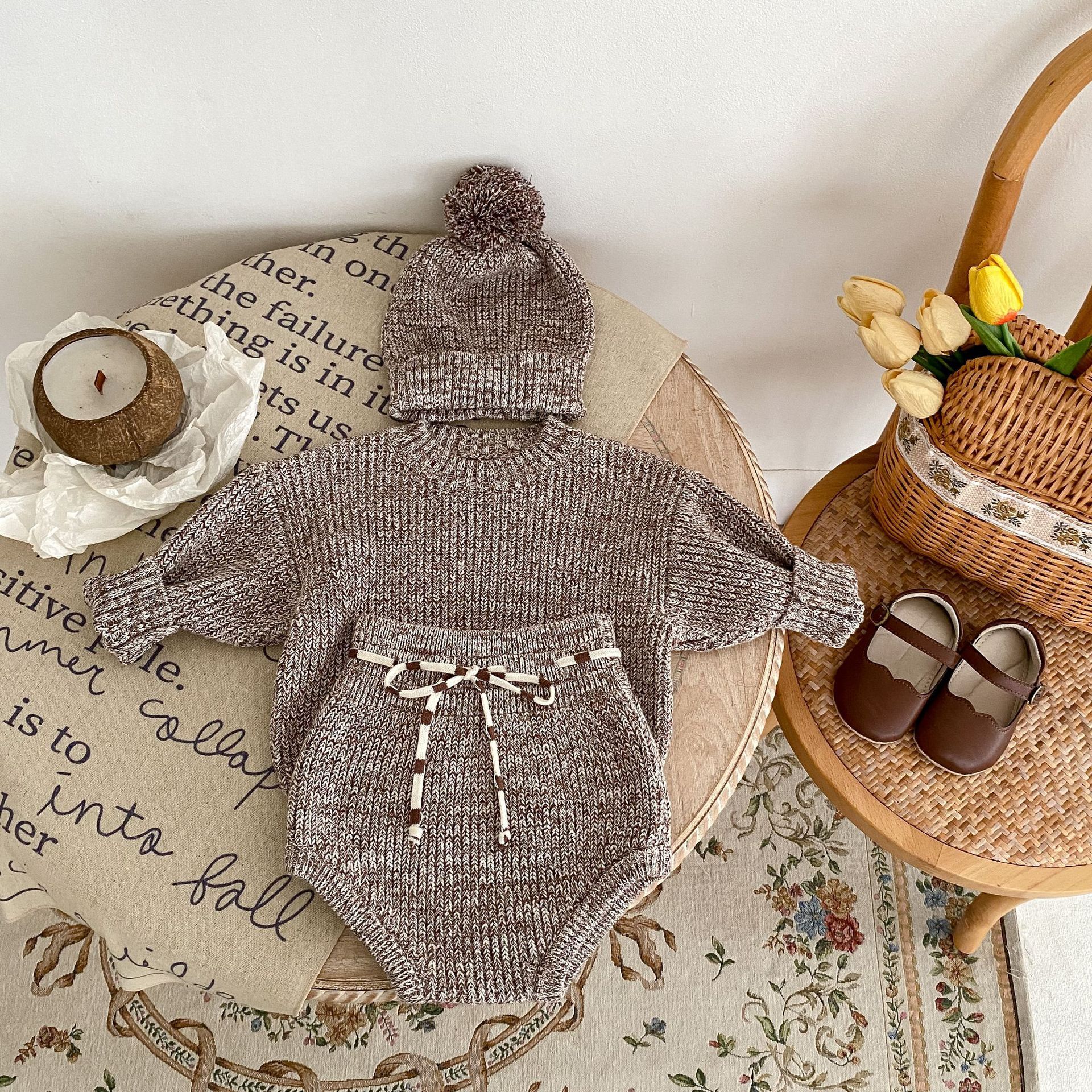 Côte & Crown knitted brown baby outfit with long sleeve top, matching pants, and pom-pom hat