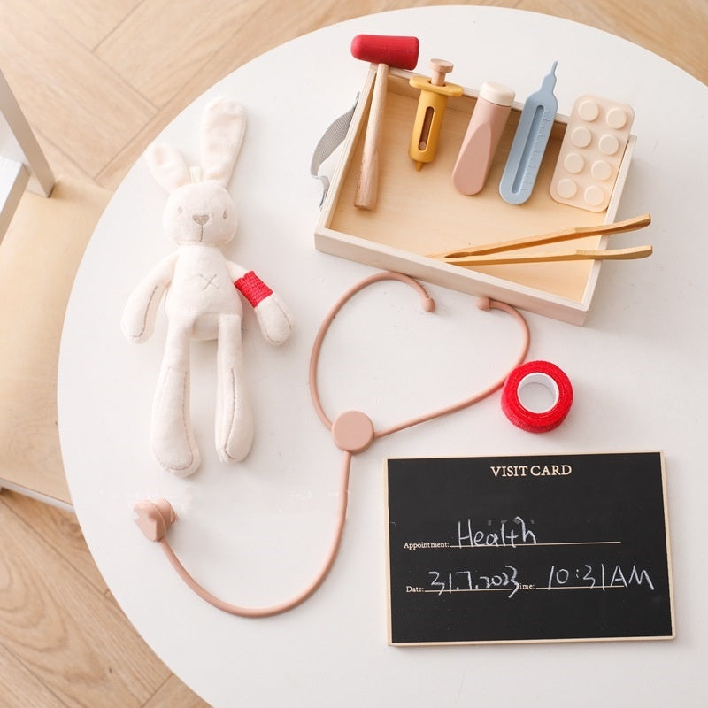 Côte & Crown children's doctor play set with plush bunny and medical tools on white table