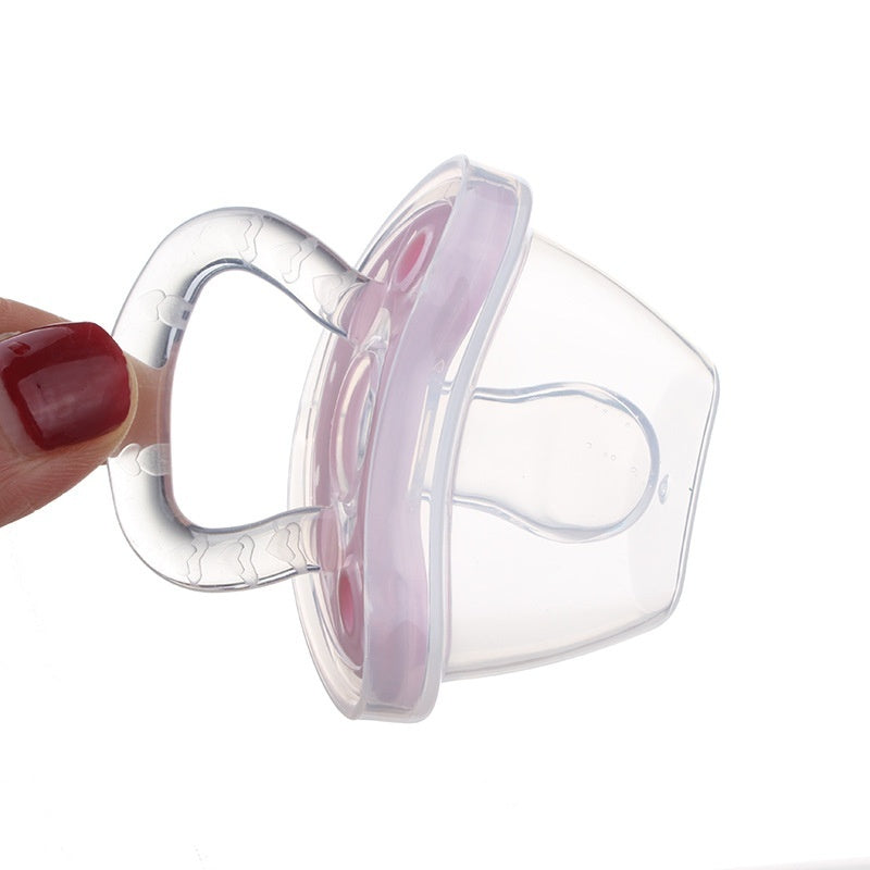 Côte & Crown silicone baby pacifier BPA free with clear handle and pink cushion held by hand