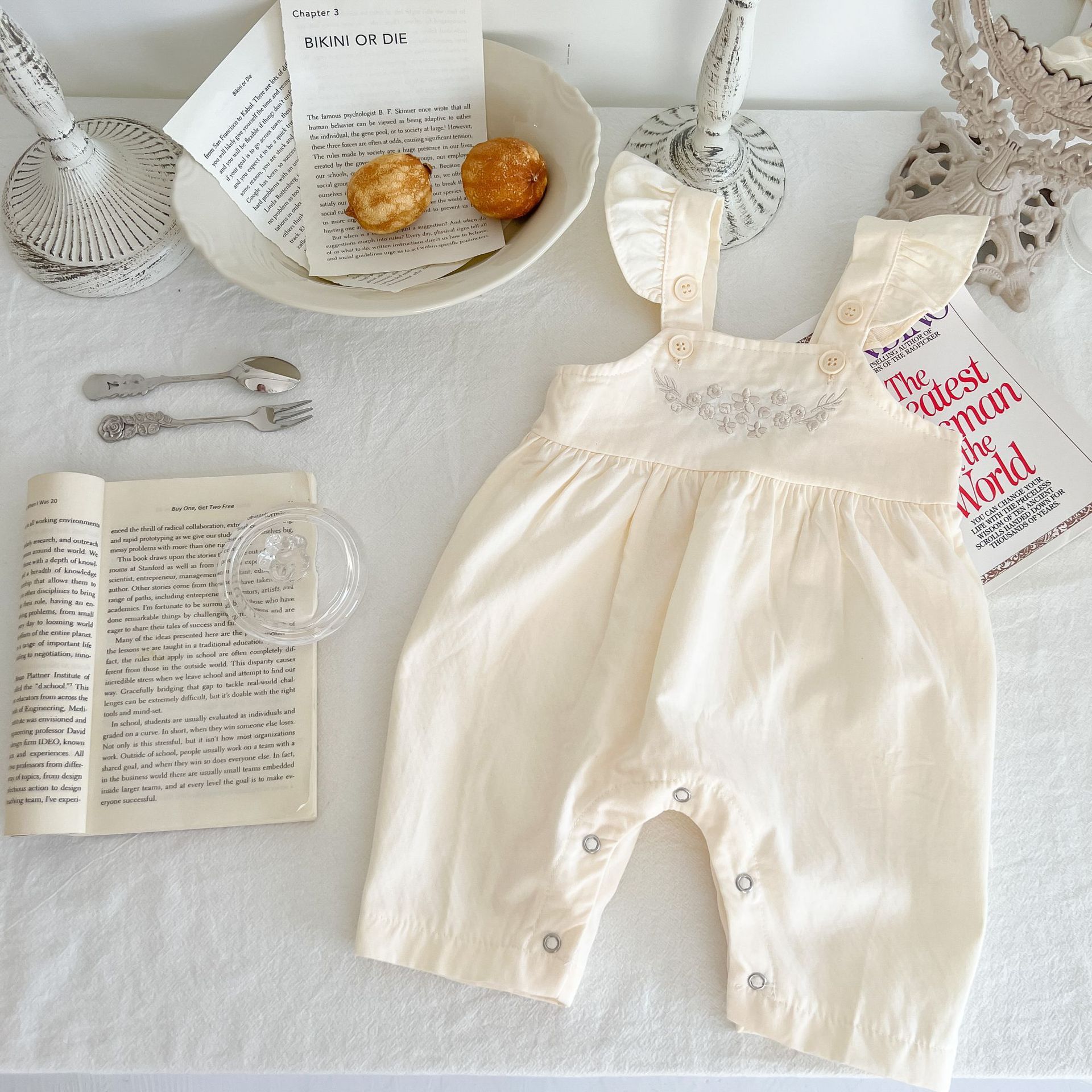Côte & Crown baby girl loose adjustable suspender romper in cream luxury baby girl outfit affordable
