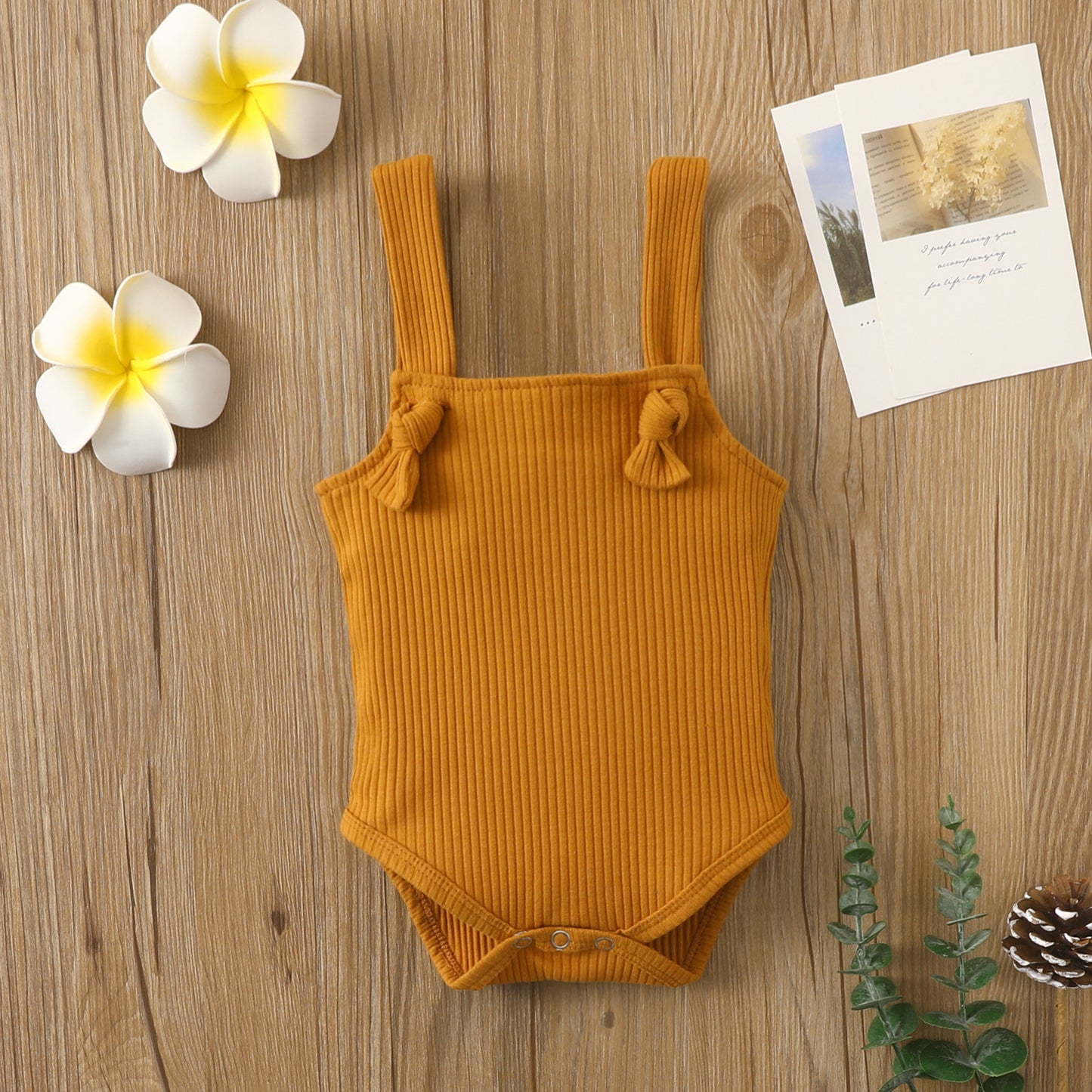 Côte & Crown baby strap small romper in mustard yellow soft cotton romper for babies with knotted straps