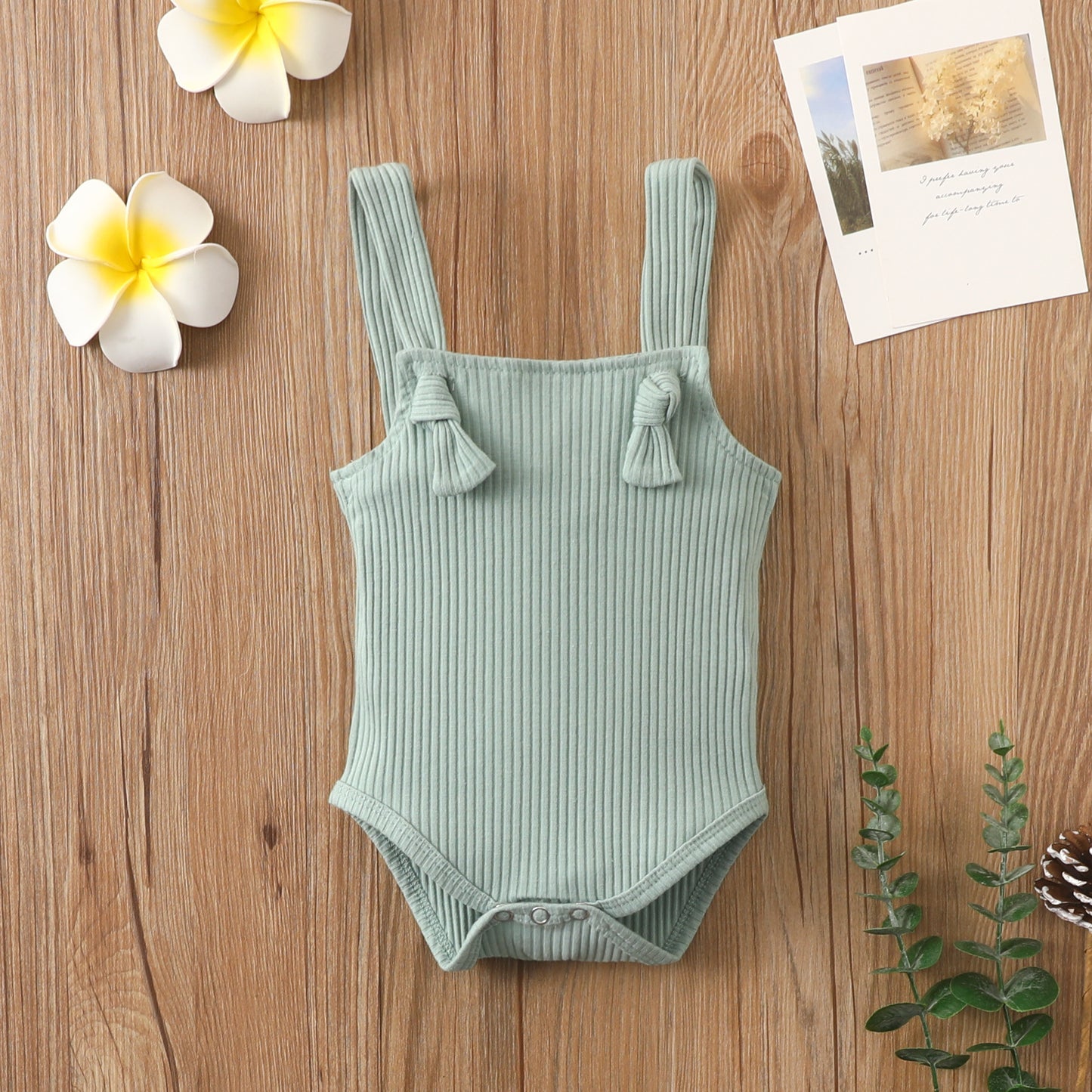 Côte & Crown baby strap small romper in soft green made from soft cotton romper for babies