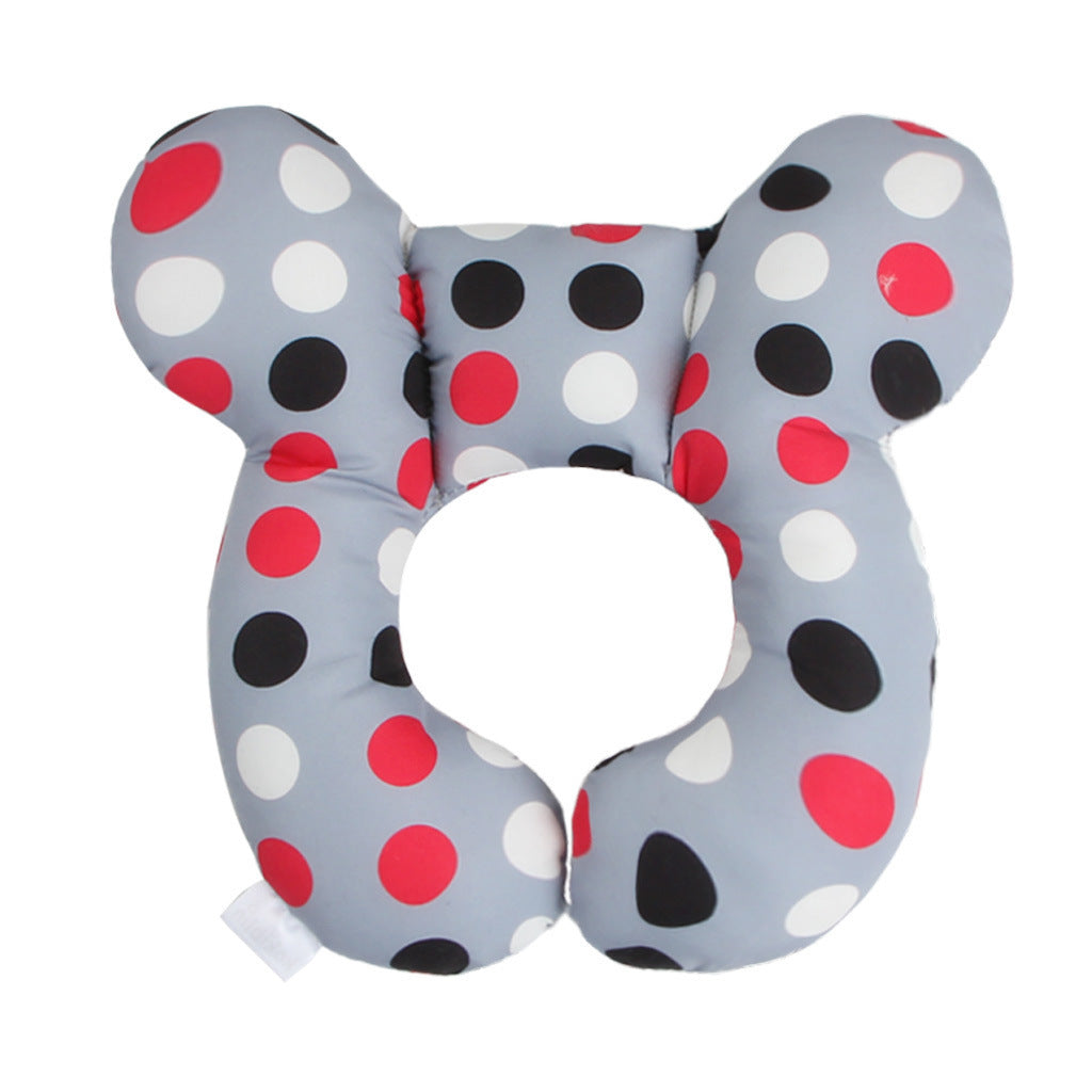 Côte & Crown U-Shaped Neck Guard Pillow for Stroller with red black and white polka dots on gray background