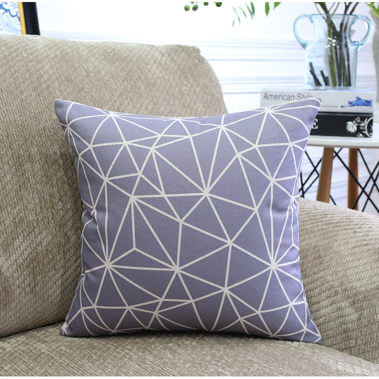 Côte & Crown decorative soft furnishing cushion with geometric pattern on beige sofa