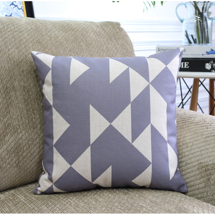Côte & Crown geometric patterned soft furnishing cushion in grey and cream on beige sofa