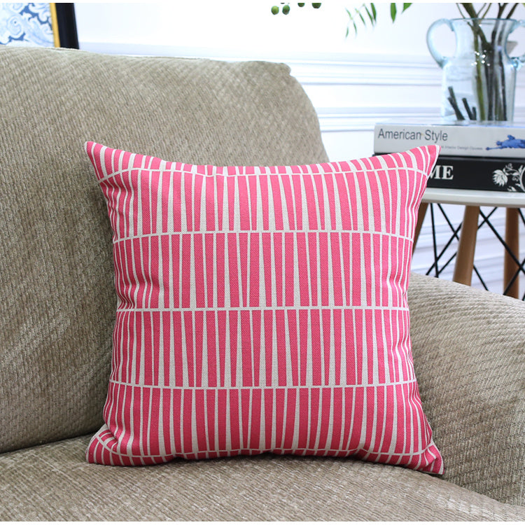 Côte & Crown pink patterned soft furnishing cushion on beige fabric sofa