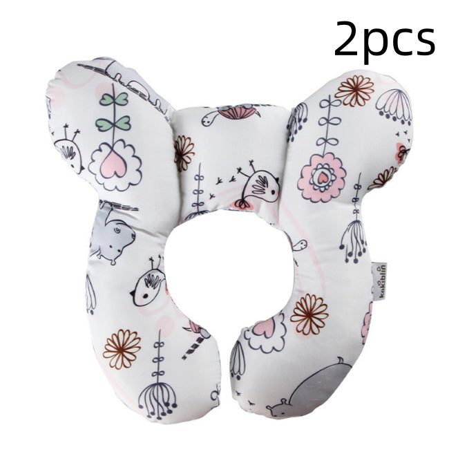 U-shaped neck guard pillow for stroller by Côte & Crown with floral and animal print in soft pastel colors