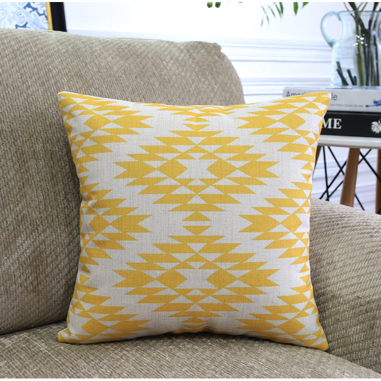 Côte & Crown soft furnishing yellow and white geometric patterned cushion on beige sofa