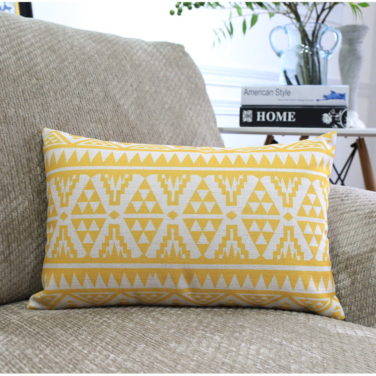 Côte & Crown yellow geometric patterned soft furnishing cushion on beige sofa 