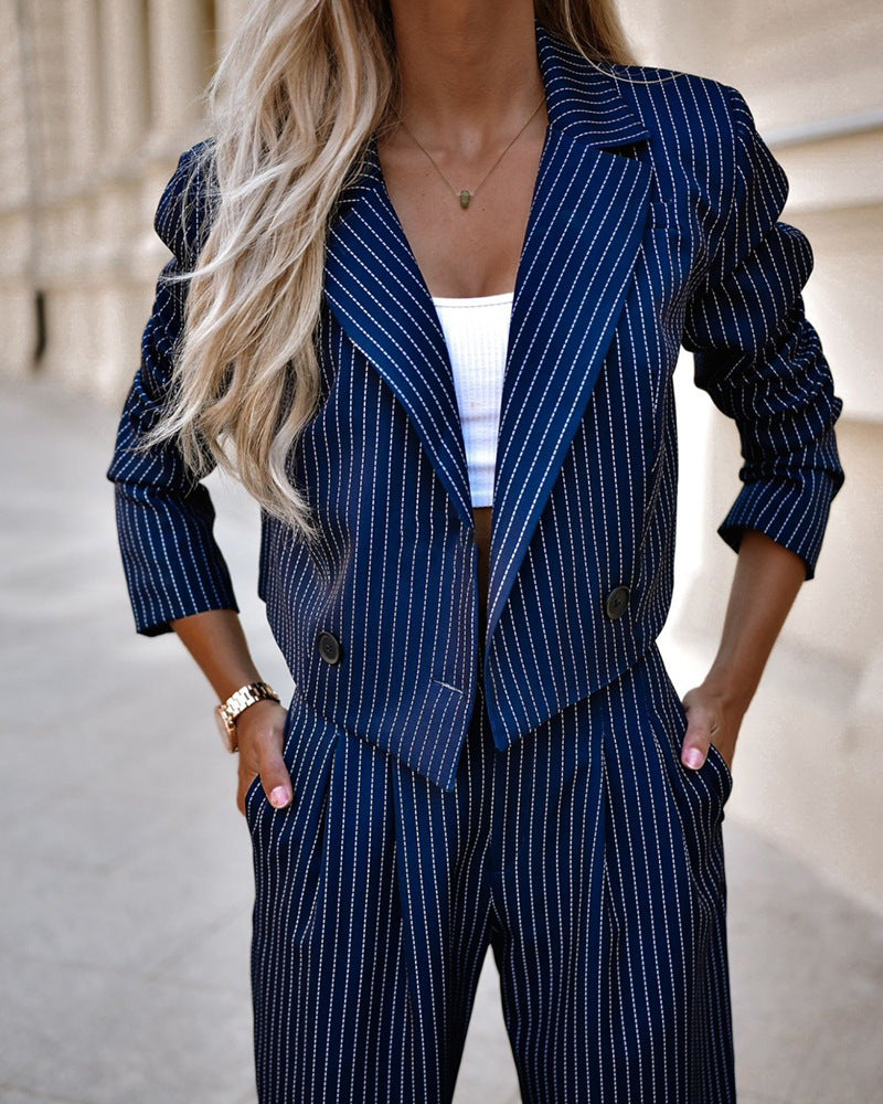  women's office blazer with pinstripes, styled with a crop top for a chic look
